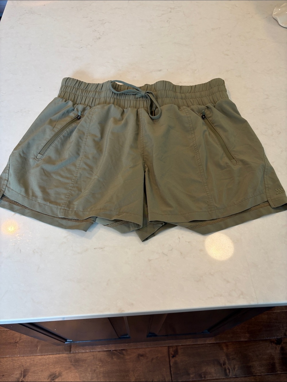 all in motion olive athletic shorts with zip pockets